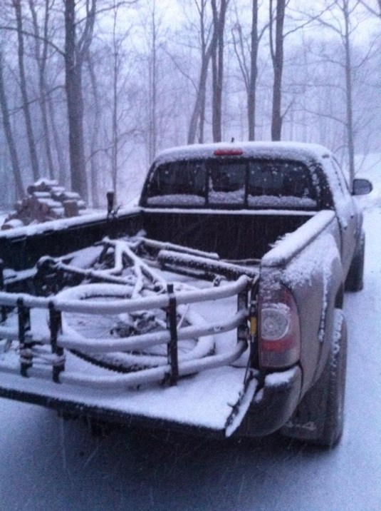 mountain bike in truck in snow