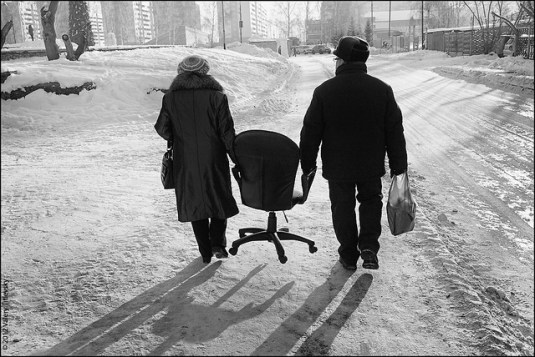 2 holding pocketbooks walking on ice sharing the weight keeping head warm furnishing home balancing load always returning home