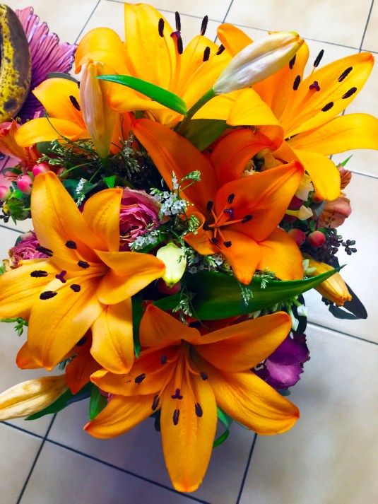 Birthday Flowers from my daughter Move from orange roses to orange tiger lilies in one week