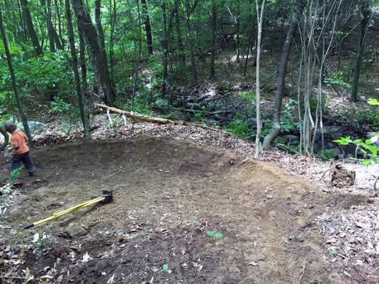 Oliver sculpts the bike path. 